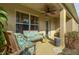 Relaxing covered porch with comfy seating at 218 Black Springs Ln, Winter Garden, FL 34787
