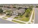 Aerial view of single-Gathering home with driveway and landscaping at 2714 Stargrass Cir, Clermont, FL 34715