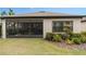 Home exterior showcasing a screened patio and landscaping at 2714 Stargrass Cir, Clermont, FL 34715