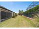 Spacious backyard with screened patio and lush landscaping at 2714 Stargrass Cir, Clermont, FL 34715