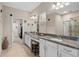 Elegant bathroom with double vanity, granite countertops, and a large shower at 2714 Stargrass Cir, Clermont, FL 34715