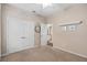 Bright bedroom with double doors leading to the bathroom at 2714 Stargrass Cir, Clermont, FL 34715