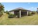 Well-maintained home with a screened patio and lush landscaping at 2714 Stargrass Cir, Clermont, FL 34715