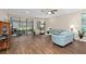 Spacious living area featuring hardwood floors and access to a relaxing patio at 2714 Stargrass Cir, Clermont, FL 34715