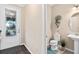 Small half bathroom with a single sink, toilet, and decorative accents at 2714 Stargrass Cir, Clermont, FL 34715