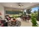 Relaxing screened patio with seating area and dining table at 2714 Stargrass Cir, Clermont, FL 34715