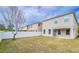 Spacious backyard with a privacy fence and grassy area at 2746 Stanwood Dr, Kissimmee, FL 34743