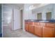 Bathroom with double vanity and access to bedroom at 2746 Stanwood Dr, Kissimmee, FL 34743
