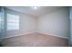 Empty bedroom with carpeted floor and window at 2746 Stanwood Dr, Kissimmee, FL 34743