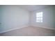 Empty bedroom with carpeted floor and window at 2746 Stanwood Dr, Kissimmee, FL 34743