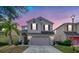 Two-story house with neutral siding, two-car garage, and landscaping at 2746 Stanwood Dr, Kissimmee, FL 34743
