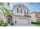 Two-story house with neutral siding, two-car garage, and landscaping at 2746 Stanwood Dr, Kissimmee, FL 34743