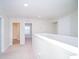 Upstairs hallway with carpet, doors to bedrooms and bathroom at 2746 Stanwood Dr, Kissimmee, FL 34743