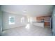 Open kitchen with island, wood cabinets, and tile floors at 2746 Stanwood Dr, Kissimmee, FL 34743