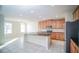 Open kitchen with island, granite countertops, and stainless steel appliances at 2746 Stanwood Dr, Kissimmee, FL 34743