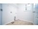 Bright laundry room with tile floor and shelving at 2746 Stanwood Dr, Kissimmee, FL 34743