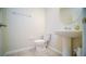 Small powder room with pedestal sink and tile flooring at 2746 Stanwood Dr, Kissimmee, FL 34743
