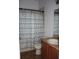 Clean bathroom with shower/tub, toilet and wood vanity at 515 Haywood Ln, Lake Alfred, FL 33850