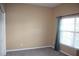 This bedroom features neutral paint, new carpet and a large window for plenty of light at 515 Haywood Ln, Lake Alfred, FL 33850