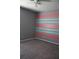 Bedroom with gray walls and teal and coral stripes at 515 Haywood Ln, Lake Alfred, FL 33850