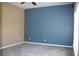 Spacious bedroom featuring neutral carpet, ceiling fan, and light-filled window at 515 Haywood Ln, Lake Alfred, FL 33850
