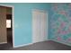 This brightly-painted bedroom features modern walls, closet and cozy carpeting at 515 Haywood Ln, Lake Alfred, FL 33850