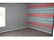 A calming bedroom features a large window providing great natural light, and updated flooring at 515 Haywood Ln, Lake Alfred, FL 33850