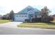Charming one-story home with a white garage door and manicured lawn at 515 Haywood Ln, Lake Alfred, FL 33850