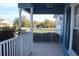View from front porch of bright blue house, showing front yard and street at 515 Haywood Ln, Lake Alfred, FL 33850