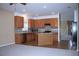 Bright, open kitchen with stainless steel appliances, granite countertops, and a central island at 515 Haywood Ln, Lake Alfred, FL 33850