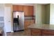 Spacious kitchen featuring stainless steel appliances, granite countertops, and tile flooring at 515 Haywood Ln, Lake Alfred, FL 33850