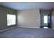 Open living room featuring hardwood flooring and a front door at 515 Haywood Ln, Lake Alfred, FL 33850