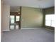 Living room featuring hardwood flooring, large windows and neutral walls at 515 Haywood Ln, Lake Alfred, FL 33850