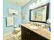 Clean bathroom, featuring a shower, granite countertop, and dark brown vanity at 5271 Whitstable Way # 1, Orlando, FL 32812