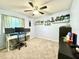 Functional bedroom with a desk and multiple monitors at 5271 Whitstable Way # 1, Orlando, FL 32812