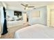 Bright bedroom featuring a king-size bed and built-in shelving at 5271 Whitstable Way # 1, Orlando, FL 32812