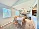 Bright dining room with a table and chairs, adjacent to the kitchen at 5271 Whitstable Way # 1, Orlando, FL 32812