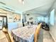 Open dining area featuring a table for six and a view of the living room at 5271 Whitstable Way # 1, Orlando, FL 32812