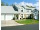 Inviting two-story townhome with a two-car garage and well-manicured lawn at 5271 Whitstable Way # 1, Orlando, FL 32812
