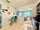 Functional kitchen with stainless steel appliances and view of dining area at 5271 Whitstable Way # 1, Orlando, FL 32812