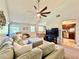 Open living and dining area with a view into the kitchen and patio access at 5271 Whitstable Way # 1, Orlando, FL 32812