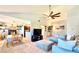 Open concept living area showcasing a comfortable sectional sofa and dining table at 5271 Whitstable Way # 1, Orlando, FL 32812