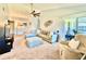 Relaxing living room with a sectional sofa, accent chair, and access to a patio at 5271 Whitstable Way # 1, Orlando, FL 32812