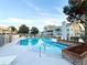 Community pool with plenty of lounge chairs at 5271 Whitstable Way # 1, Orlando, FL 32812