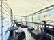 Relaxing screened porch with wicker furniture and backyard view at 5271 Whitstable Way # 1, Orlando, FL 32812