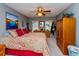 Spacious bedroom with king-size bed and wood armoire at 5700 Marlberry Dr, Orlando, FL 32819