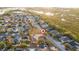 Aerial view showcasing home's location by the lake at 632 Kermarah Ave, Haines City, FL 33844