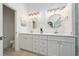 Bright bathroom boasts double vanity, large mirror, and separate shower at 632 Kermarah Ave, Haines City, FL 33844
