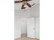 Well-lit bedroom with ceiling fan and access to another room at 632 Kermarah Ave, Haines City, FL 33844