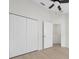 Bright bedroom with double closets and ceiling fan at 632 Kermarah Ave, Haines City, FL 33844